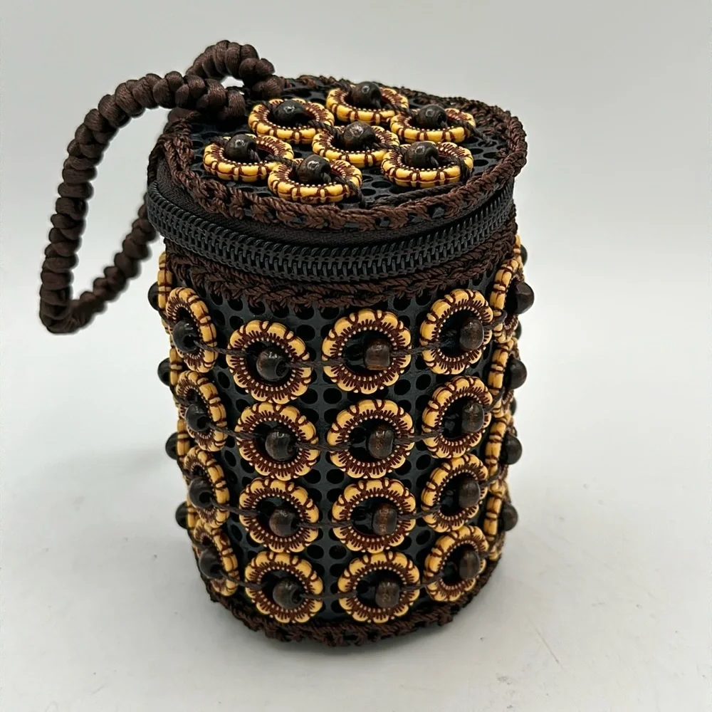 Handheld brown, tan, and black beaded coin purse